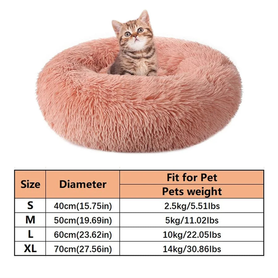 A fluffy pink pet bed shaped like a burrow for dogs and cats.