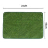 A rectangular green artificial dog grass mat measuring 70cm by 46cm for potty training.