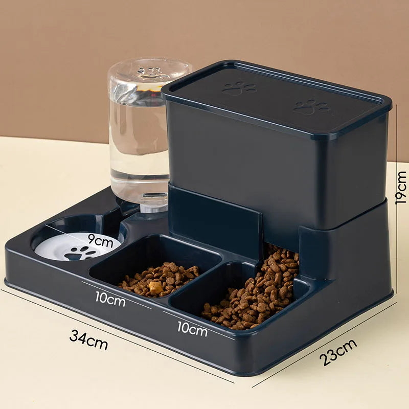 A dark gray automatic cat feeder and water fountain device with feeding compartments and a water reservoir.
