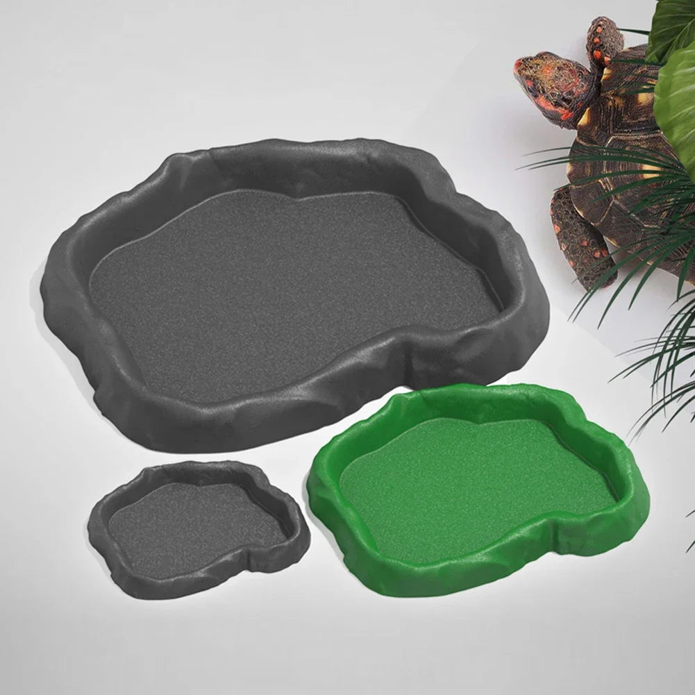 A set of three silicone feeding dishes in gray and green for natural rock reptile feeding and water.