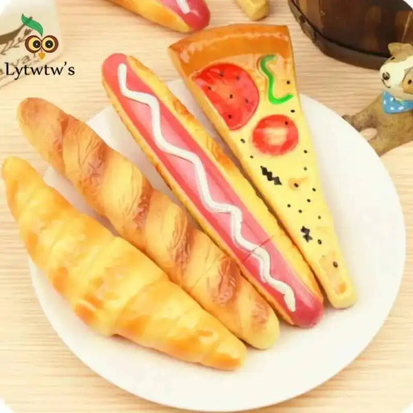 A plate featuring a novelty pizza and hot dog shaped ballpoint pen stationery items.