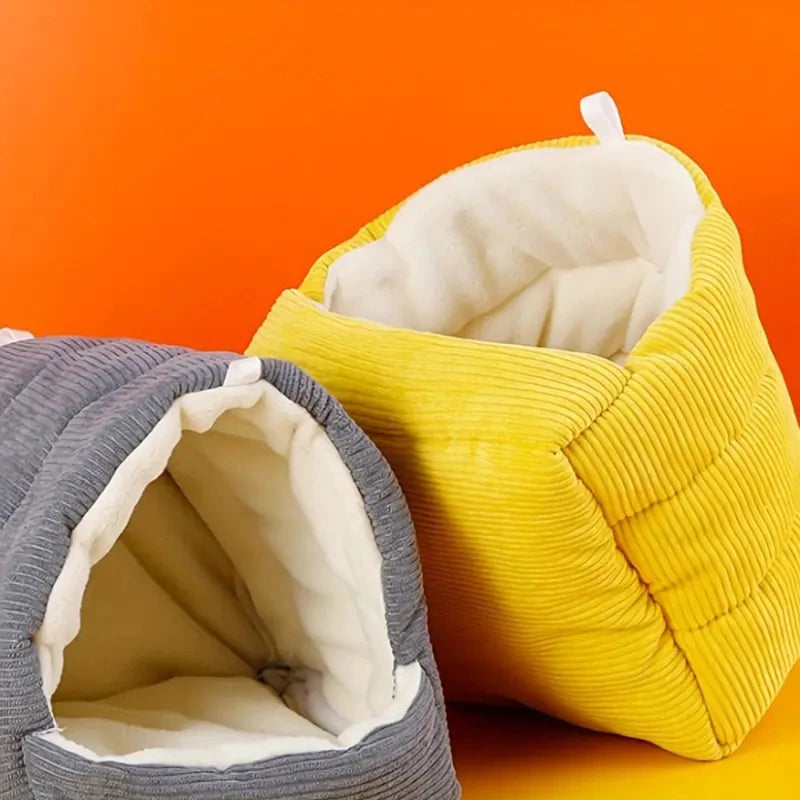 A bright yellow cozy cotton bird nest is shown next to a gray one, designed for winter comfort.