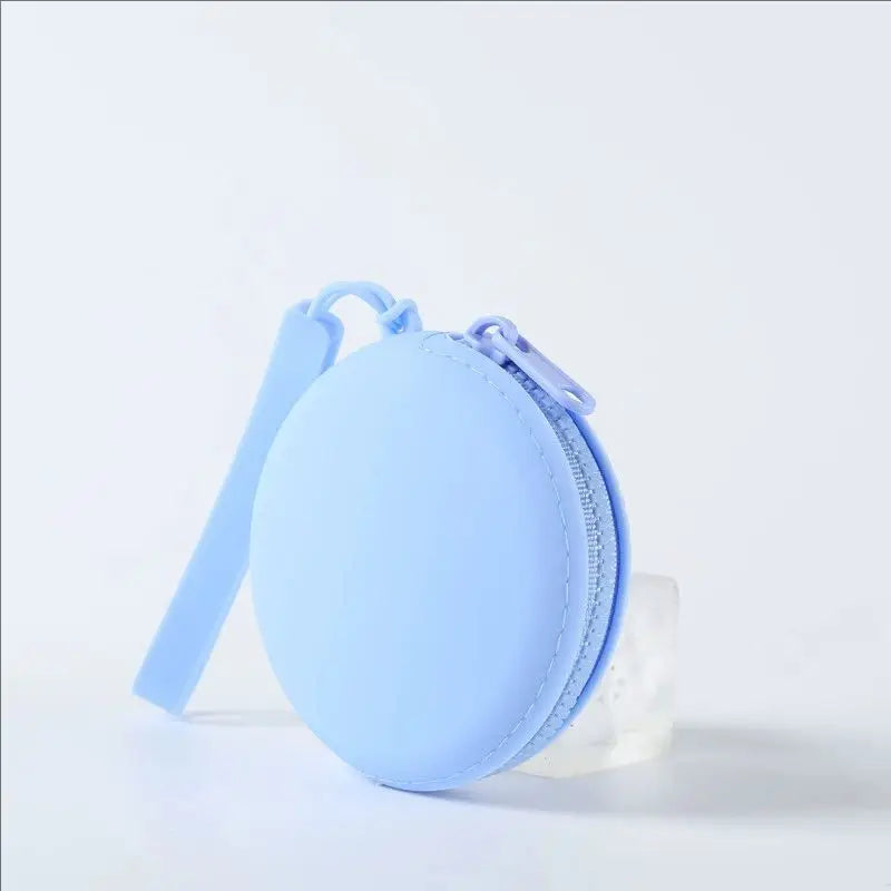 Light blue silicone pet treat pouch with a zipper and attached strap