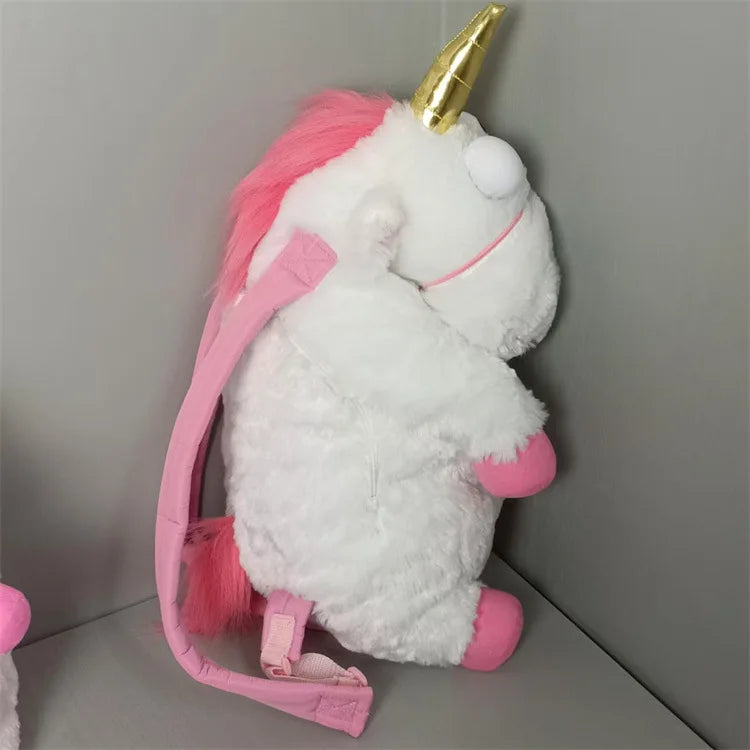 A white unicorn plush doll with pink accents and a gold horn, shown against a gray background.