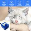 A white kitten is resting on a surface next to a blue silent replacement water pump for pet fountains.