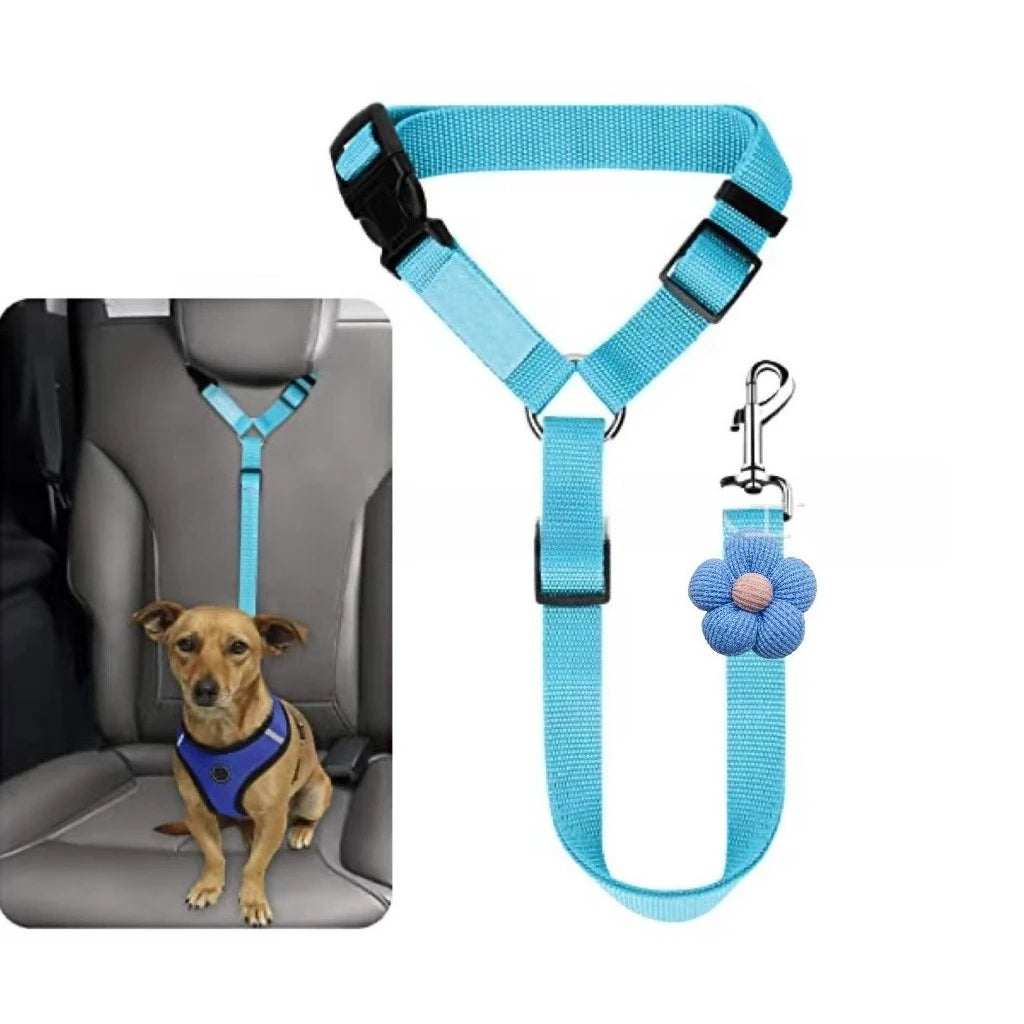 A light blue adjustable pet car seat belt with a floral accent strap shown against a gray car seat.