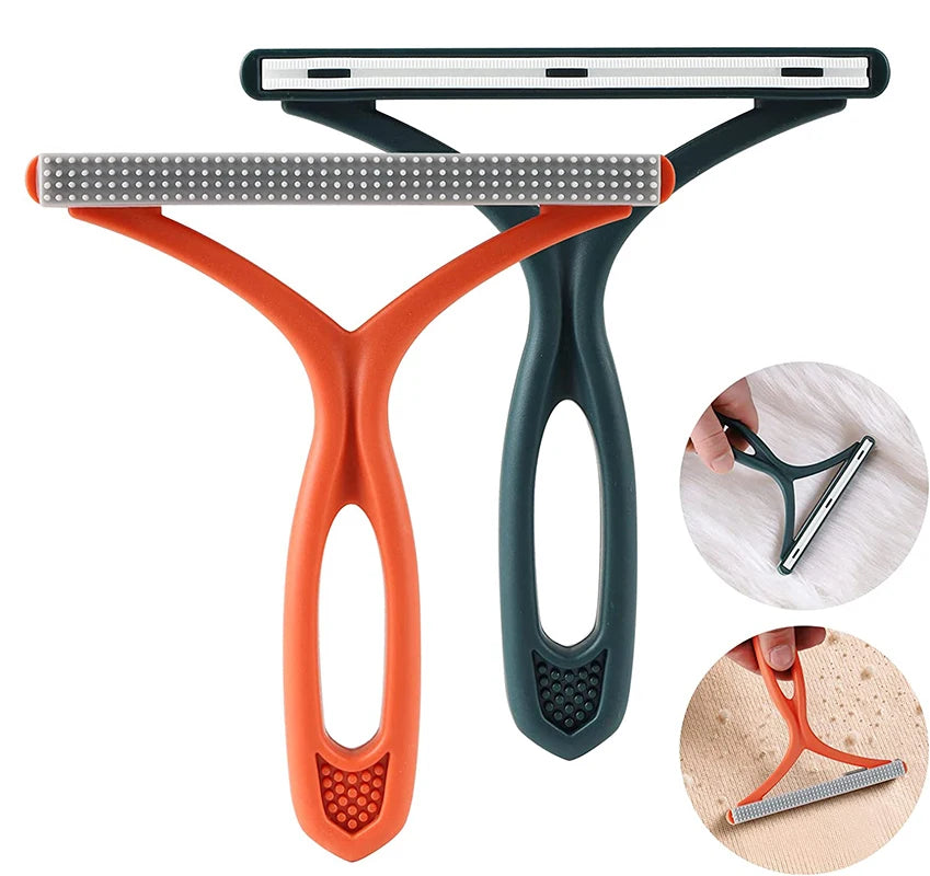 Orange and dark green double-sided brush for removing fabric and pet hair