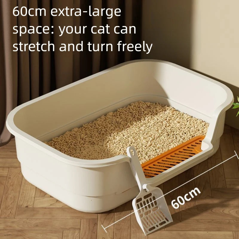 A white semi-enclosed cat litter box with a sloping floor and an orange grate is shown on a wooden floor.