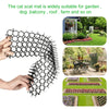 A hand holds a black cat scat mat made of prickly strips, demonstrating its use for garden and home protection.