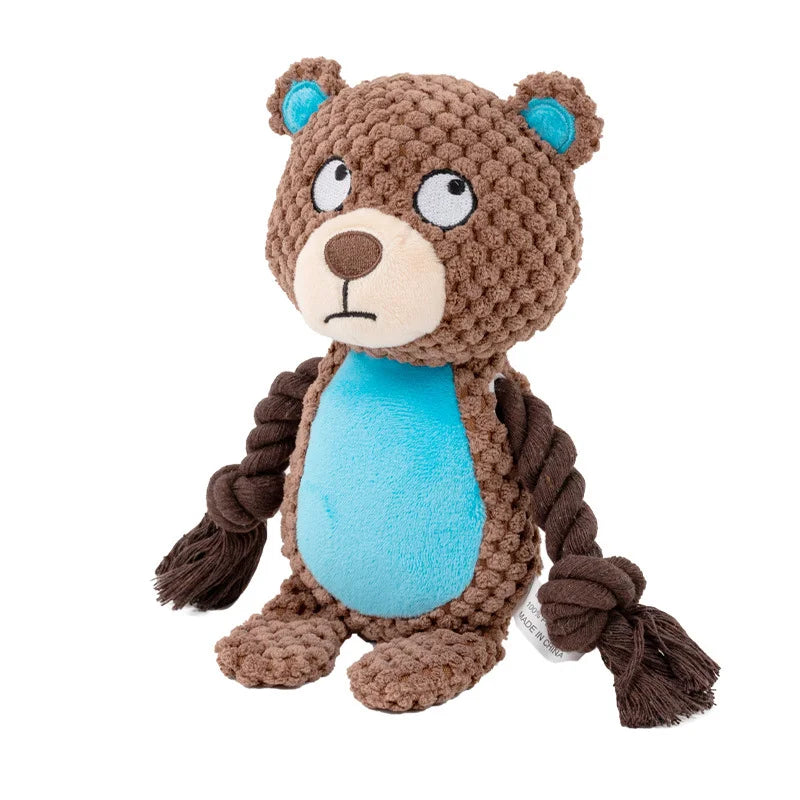 A brown plush toy resembling a bear with blue accents and rope features.