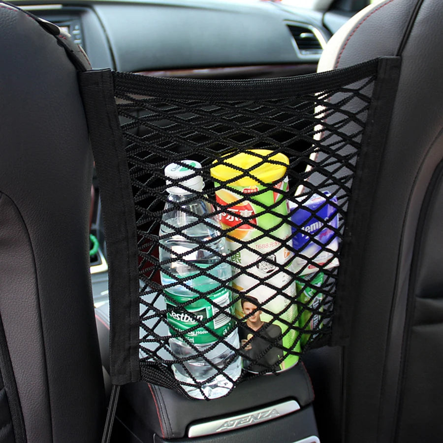 A black mesh storage bag containing various plastic bottles is placed in a car seat area.