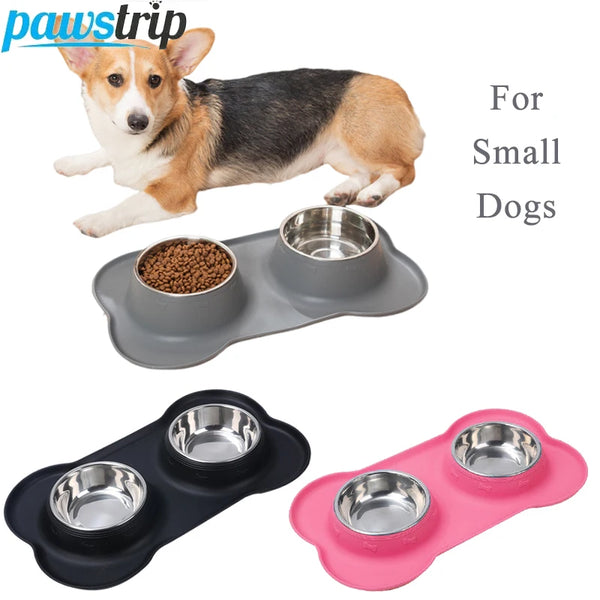 A set of three stainless steel pet bowls with non-slip silicone bases for small dogs.