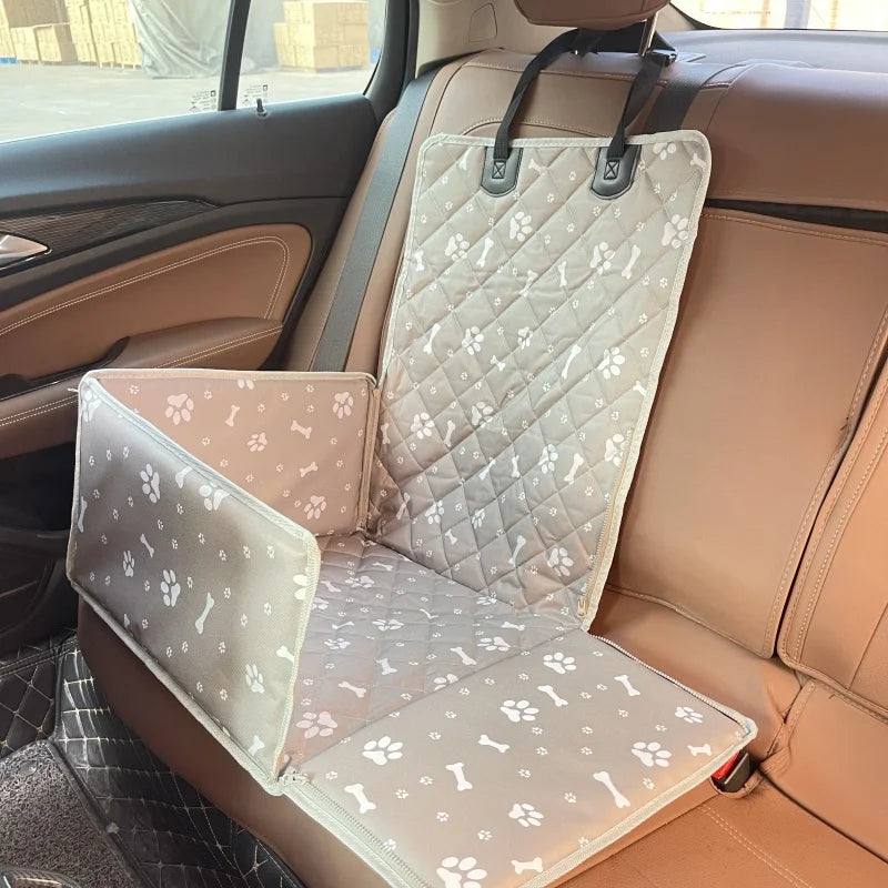 A beige waterproof dog car seat hammock installed in a vehicle interior.