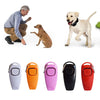 A set of five colored dog training clickers and whistles with key rings shown next to a man and a dog.
