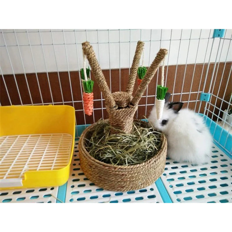 A woven grass carrot tree chew toy for rabbits and small pets is placed in a yellow tray.