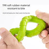 A hand holds a bright green TPR soft rubber pull ring dog chew toy designed for dental health and interactive play.