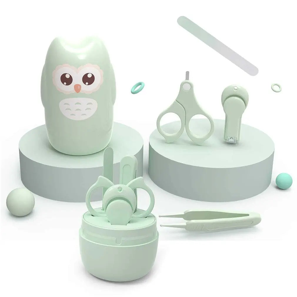 A light green portable nail care set featuring a owl-shaped container, scissors, and a small grooming tool.