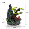 Resin aquarium rockery featuring a dark cave, tree roots, and mossy terrain.