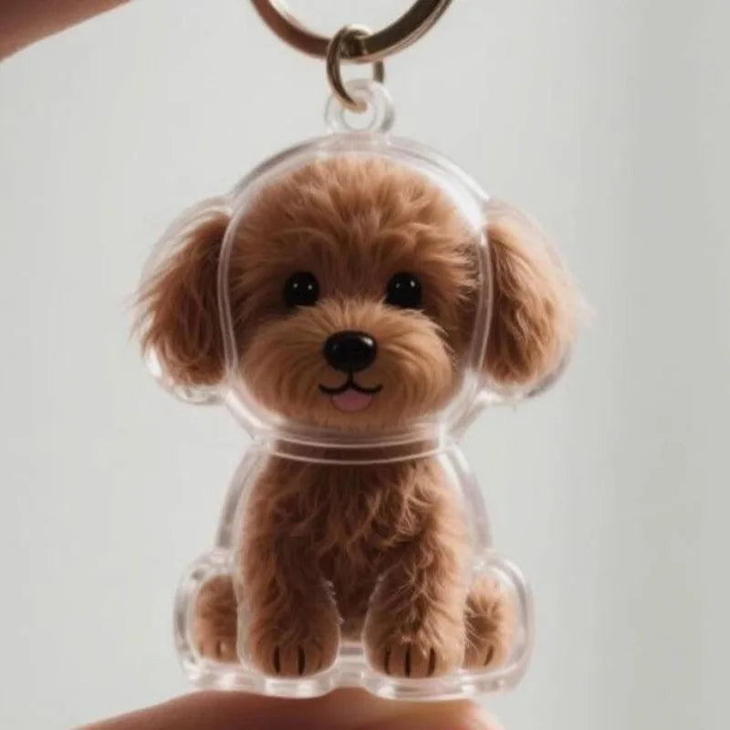 Klares Silikon-Anhänger mit einer kleinen, flauschigen braunen Hundfigur.