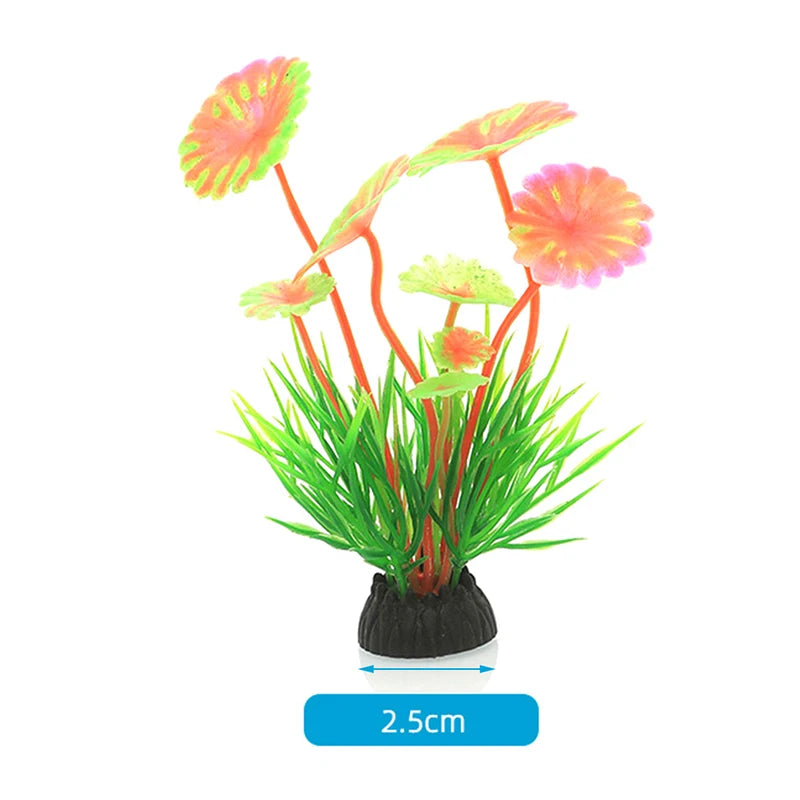 A vibrant arrangement of artificial aquarium plants with pink and orange flowers and green foliage.