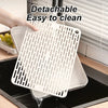 A detachable pet litter box grate is shown being used to clean a litter box.
