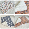 Four images of plush plaid flannel pet sleeping mats with non-slip backing in various patterns and colors