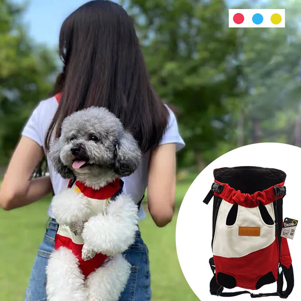 A small dog wearing a red and white breathable mesh pet carrier backpack.