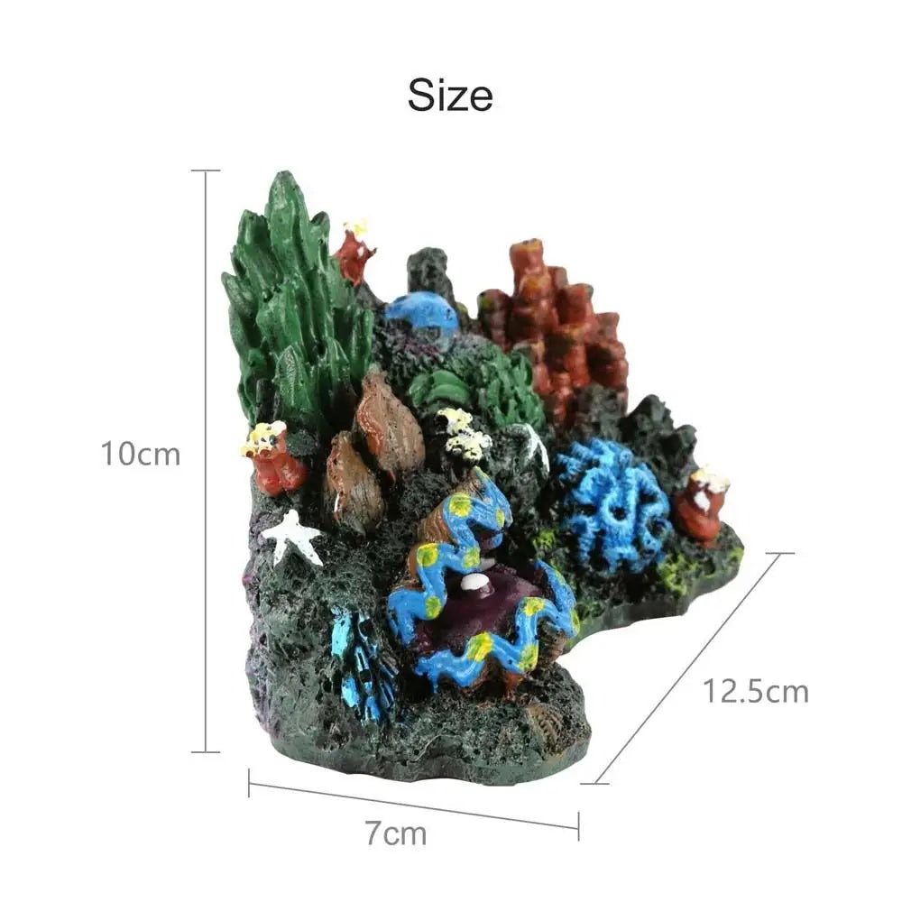 A small, textured ornament depicting a coral reef island with green and reddish marine life.