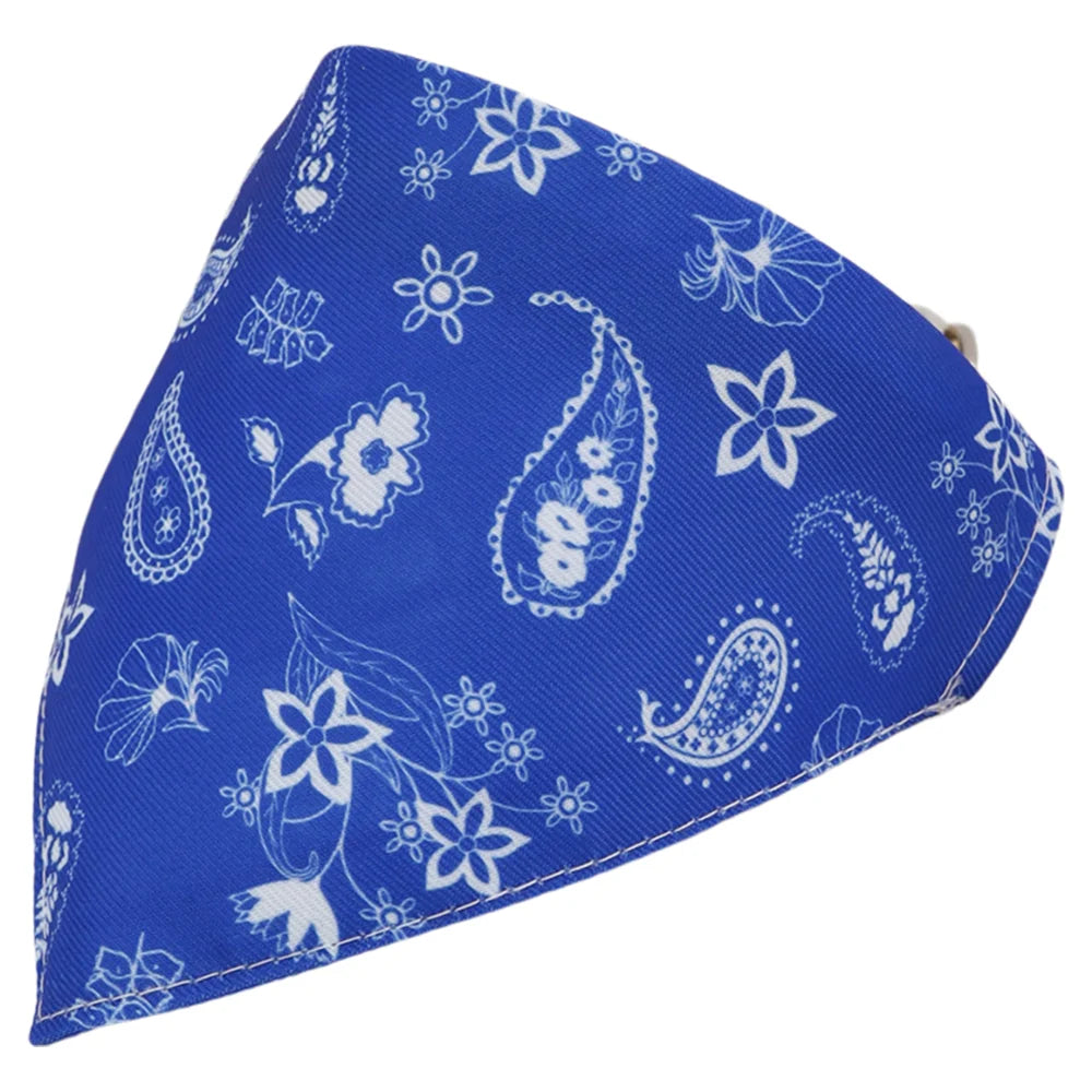 Blue cotton pet bandana with a white floral and paisley cartoon print, folded into a triangle shape.