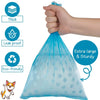 A hand is holding a light blue reusable pet poop bag, emphasizing its thick and leak-proof features.