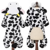 A white and black cow cartoon animal pet costume jumpsuit displayed on a mannequin.