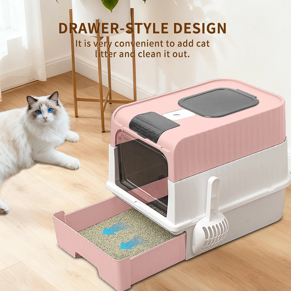 A pink and white drawer-style cat litter box is shown with a tray of litter inside on a wooden floor.