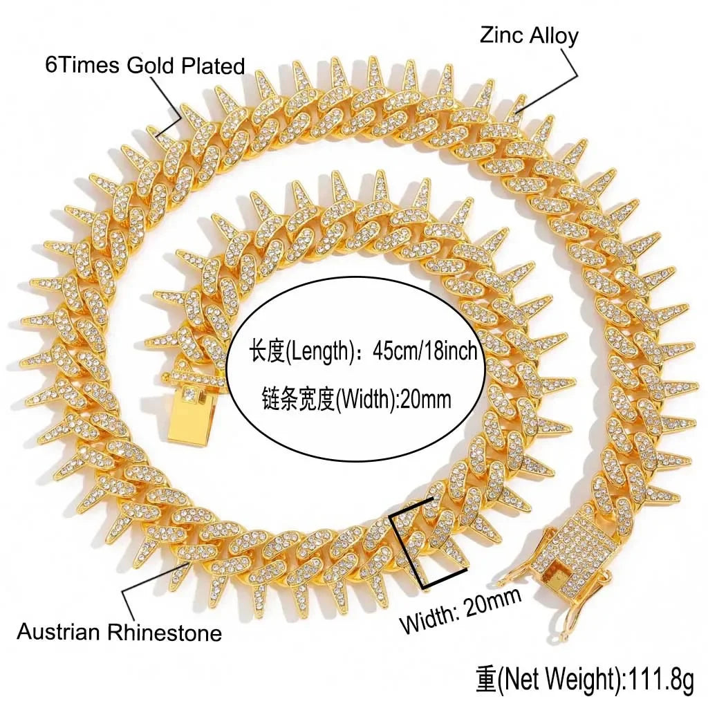 A gold-plated spiked Cuban chain bracelet featuring Austrian rhinestones and zinc alloy.