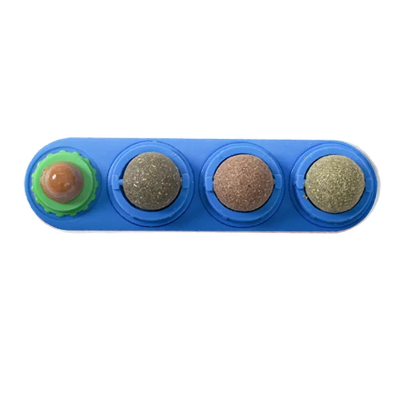 A blue plastic toy with three circular compartments containing different colored catnip balls.