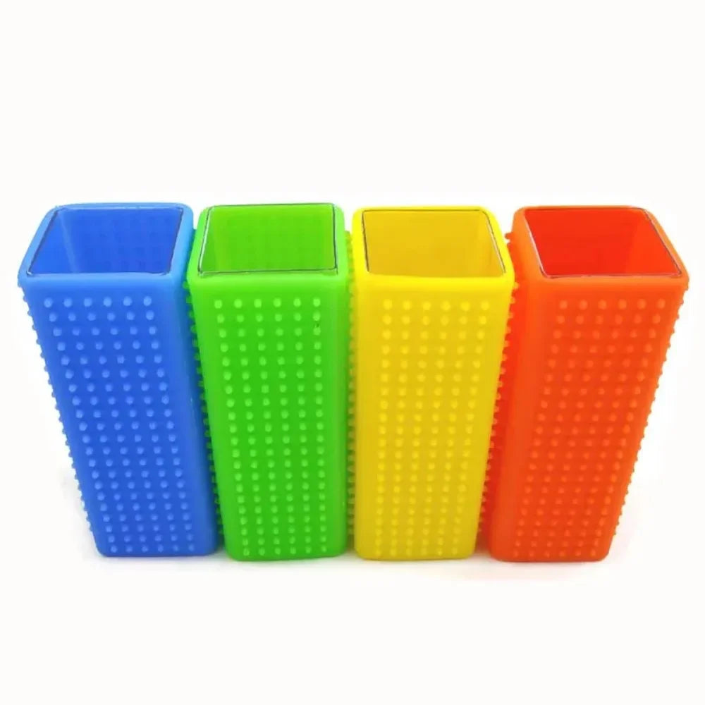 A set of four silicone pet hair remover brushes in blue, green, yellow, and orange.