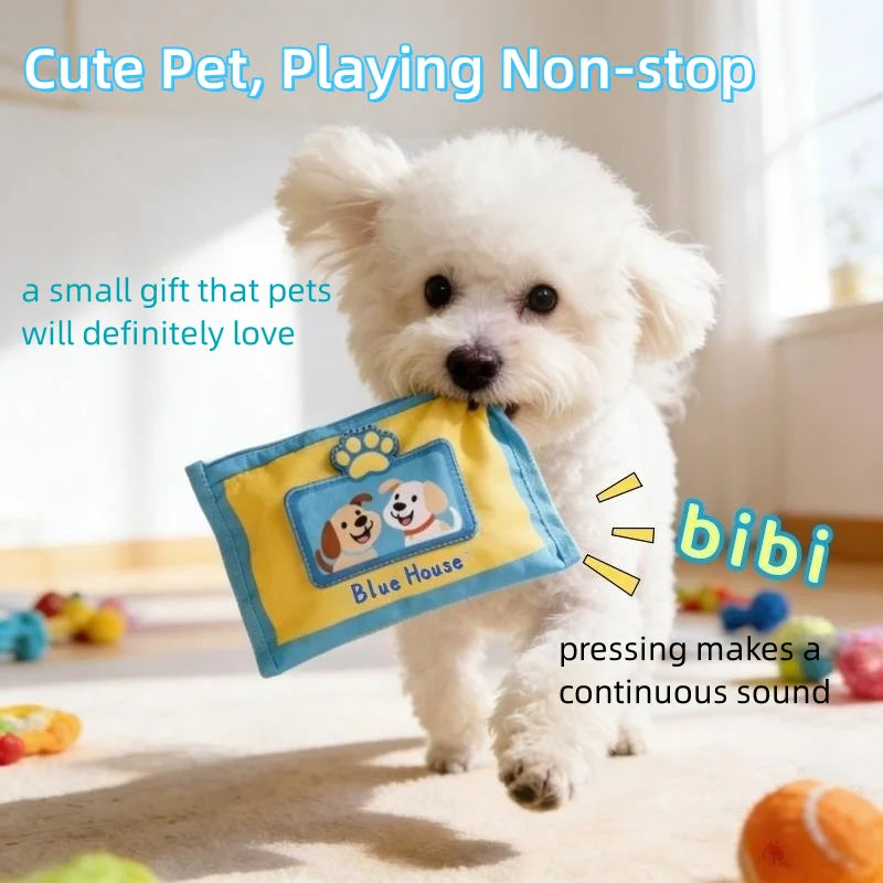 A small white dog is playing with a yellow denim puzzle toy featuring paw prints.