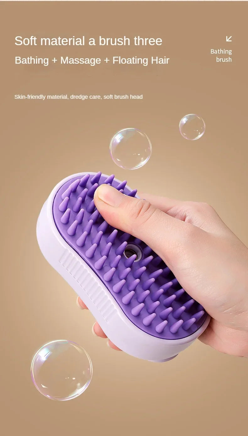 A hand holds a purple silicone grooming brush with soft bristles against a light background.