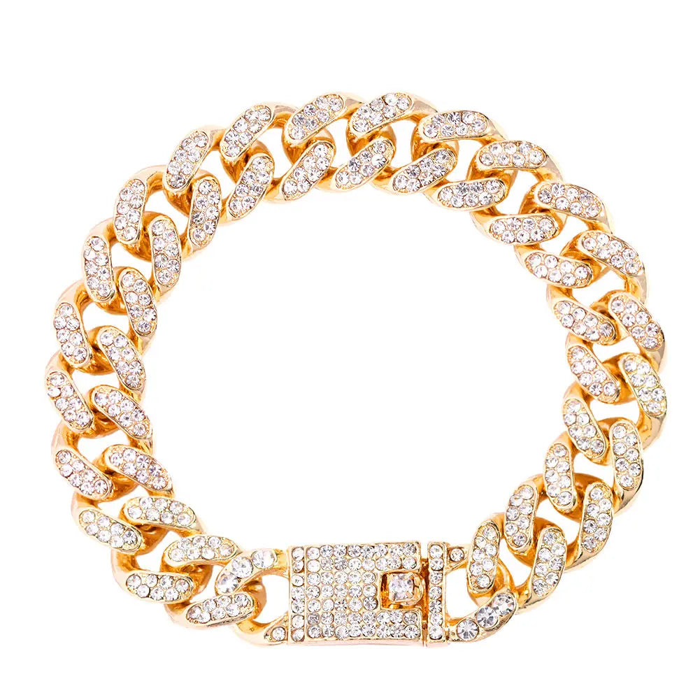 A gold iced-out Cuban link bracelet featuring rhinestone pavé stones.