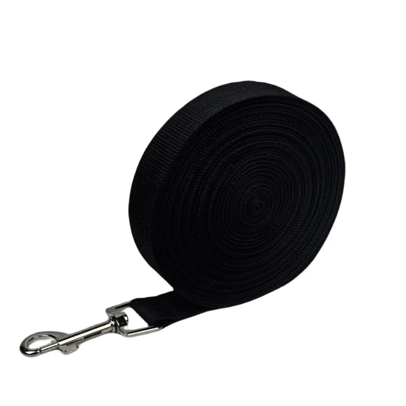 Black extended nylon dog leash rolled up for training and outdoor walks