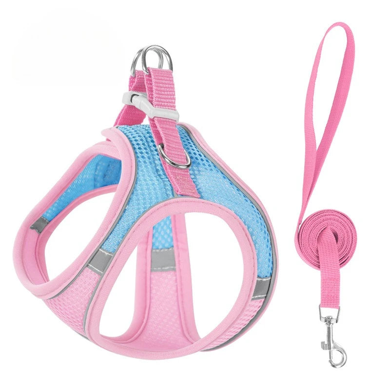 Pink reflective no-pull dog harness with a leash attached
