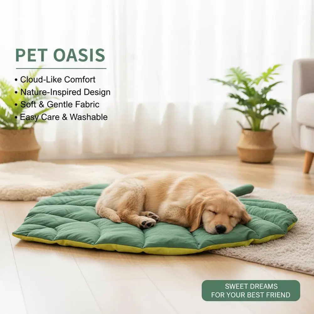 A green leaf-shaped pet mat is placed on a light wooden floor, with a golden-colored dog resting on it.