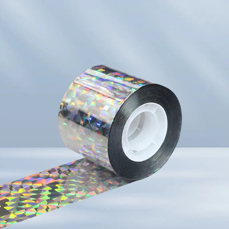 Roll of reflective bird deterrent tape with a holographic pattern