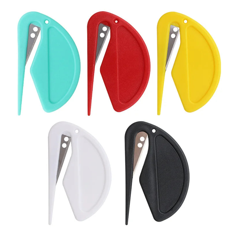A set of five stainless steel pet deshedding and knot removal tools in various colors including teal, red, yellow, white, and