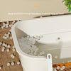 A white semi-enclosed cat litter box with a removable grate and loose litter visible inside.