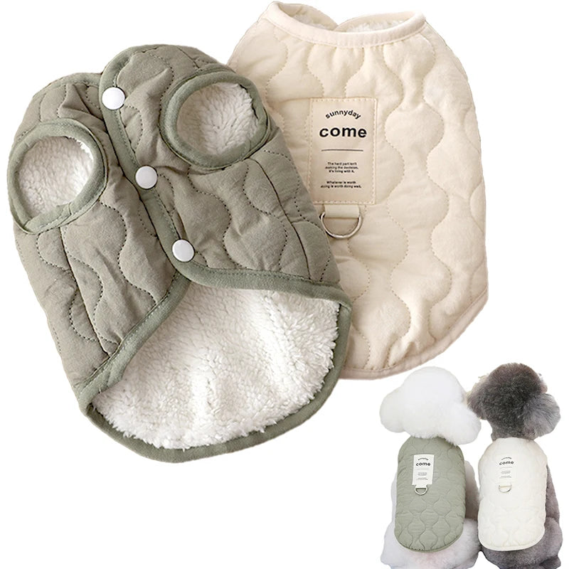 A light green quilted pet vest with a white sherpa lining and a cream-colored vest featuring the word come