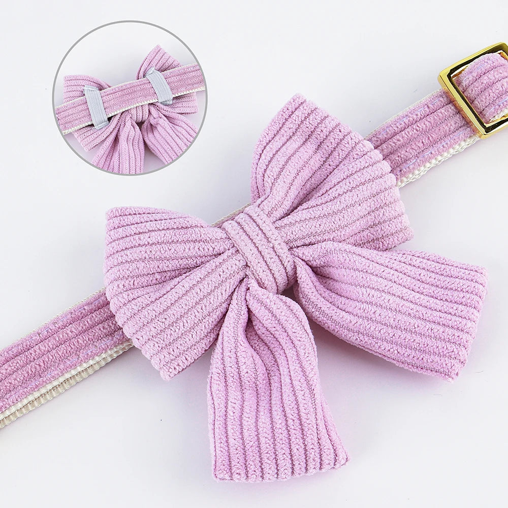 Pink knitted velvet dog collar with a large bow knot and matching strap