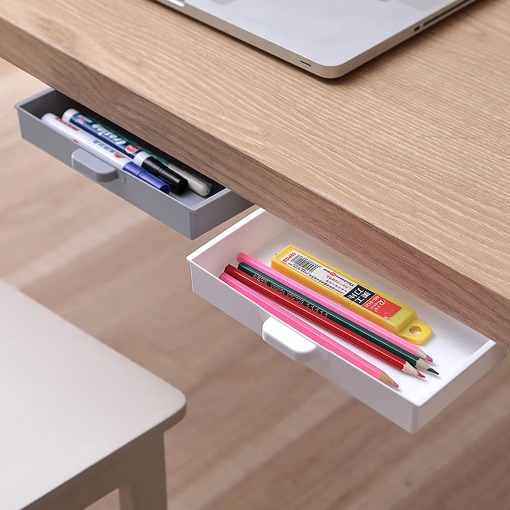 Under desk drawer organizer with dust-proof cover holding pens and pencils in a wooden shelf.