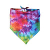 A colorful tie-dye dog bandana featuring shades of red, purple, blue, and green.
