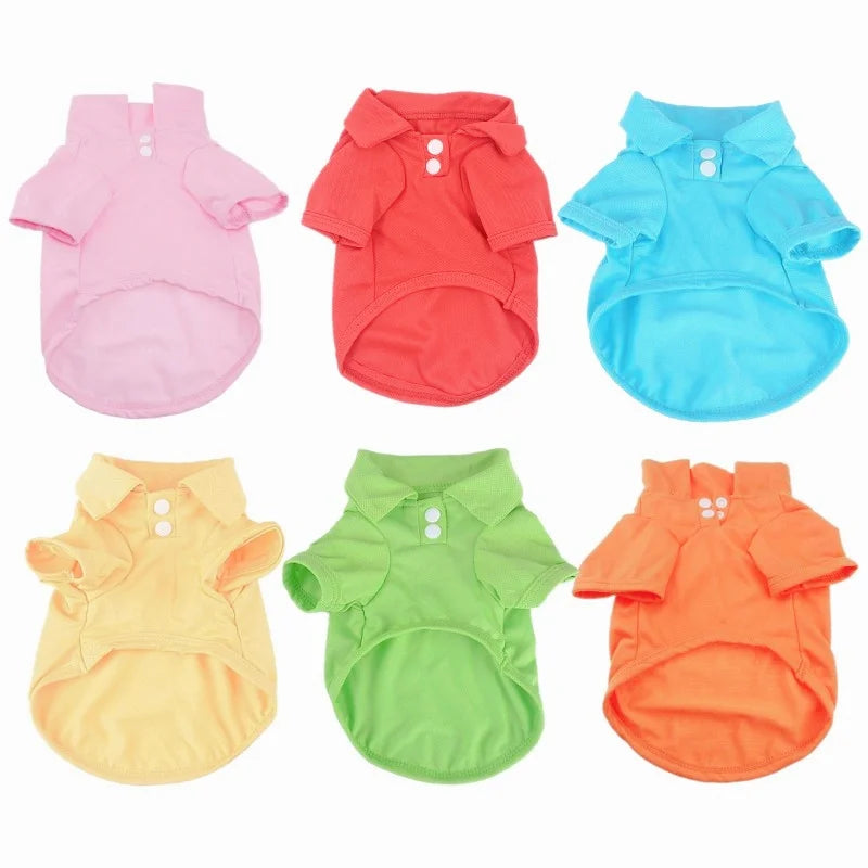 A set of five brightly colored polo shirts for small dogs in pink, red, blue, yellow, and orange.