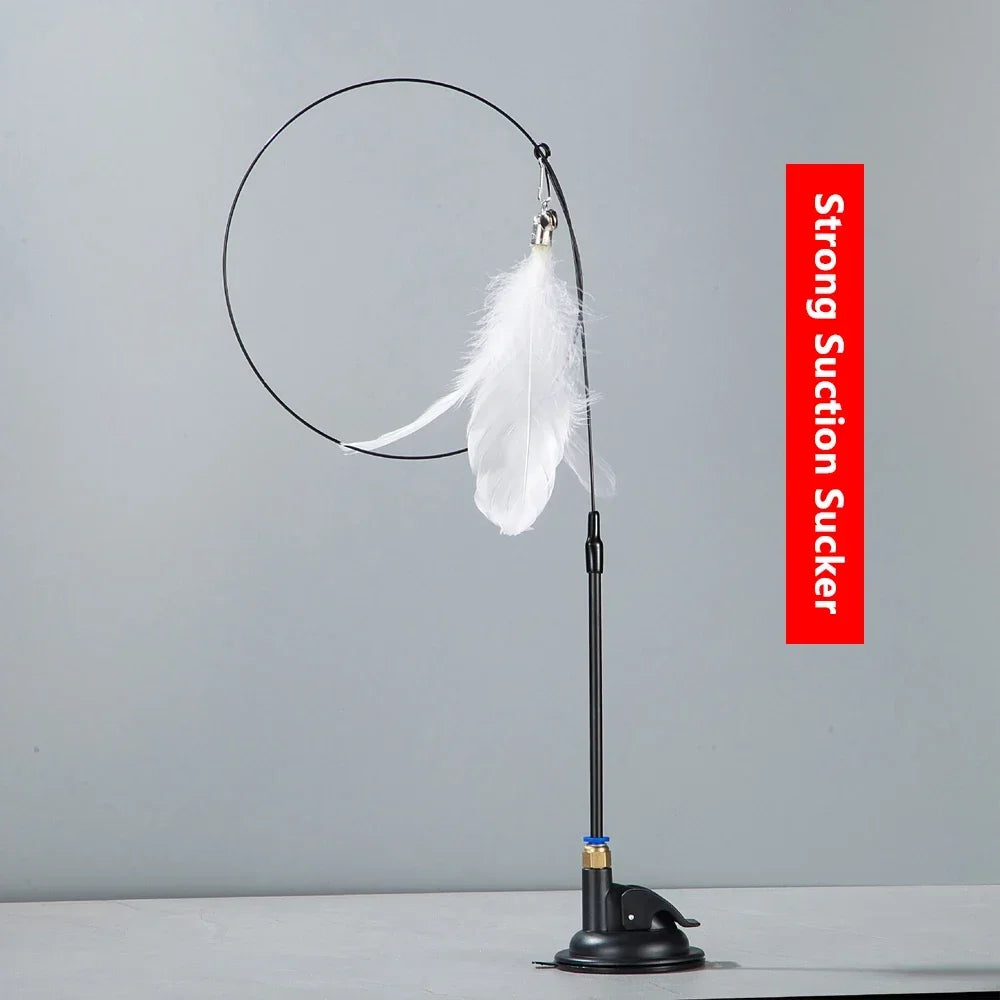 A black interactive cat teaser wand with a long rod and a white feather attached.